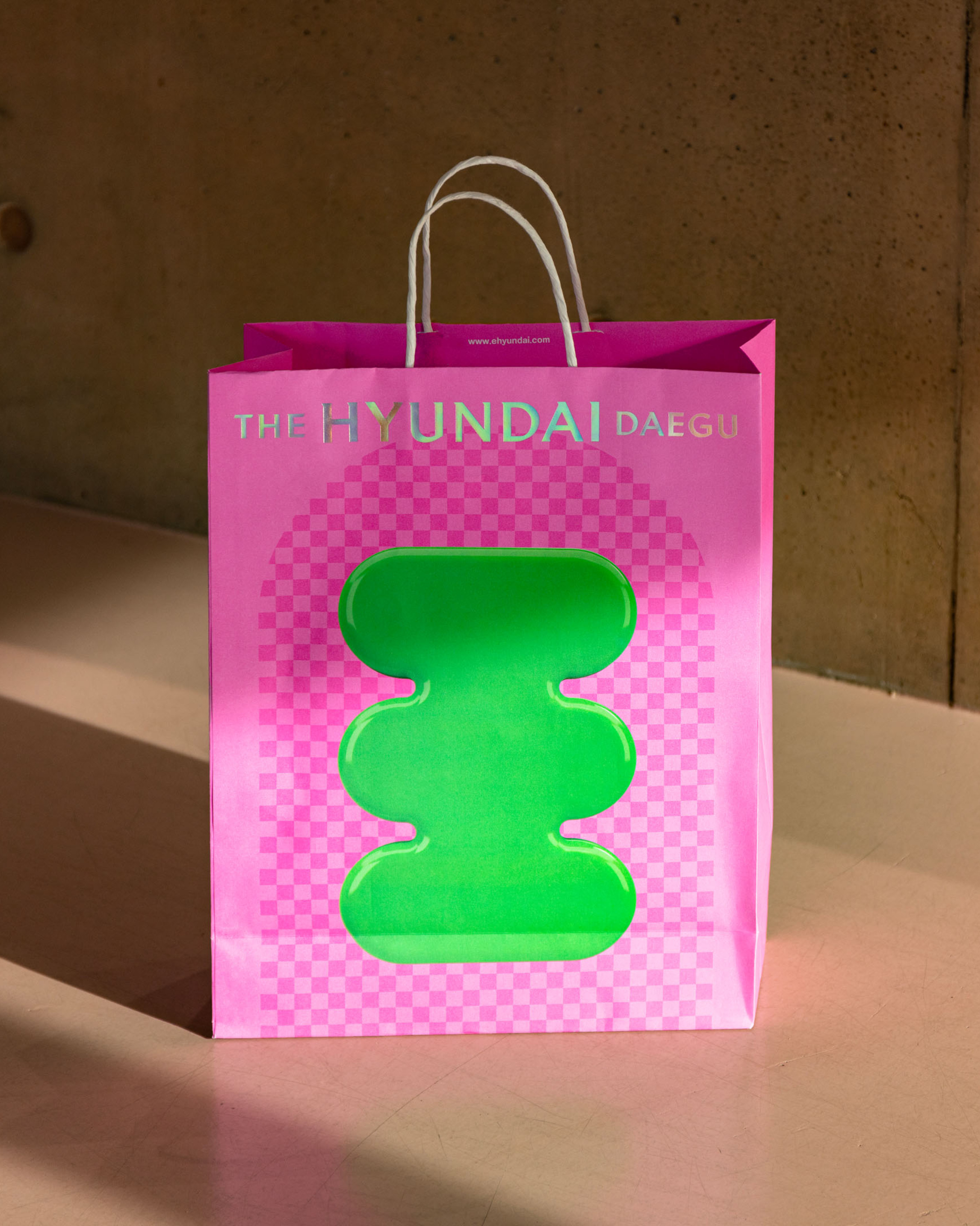 Shopping bag design as part of a campaign for the Hyundai Department Store in Daegu.